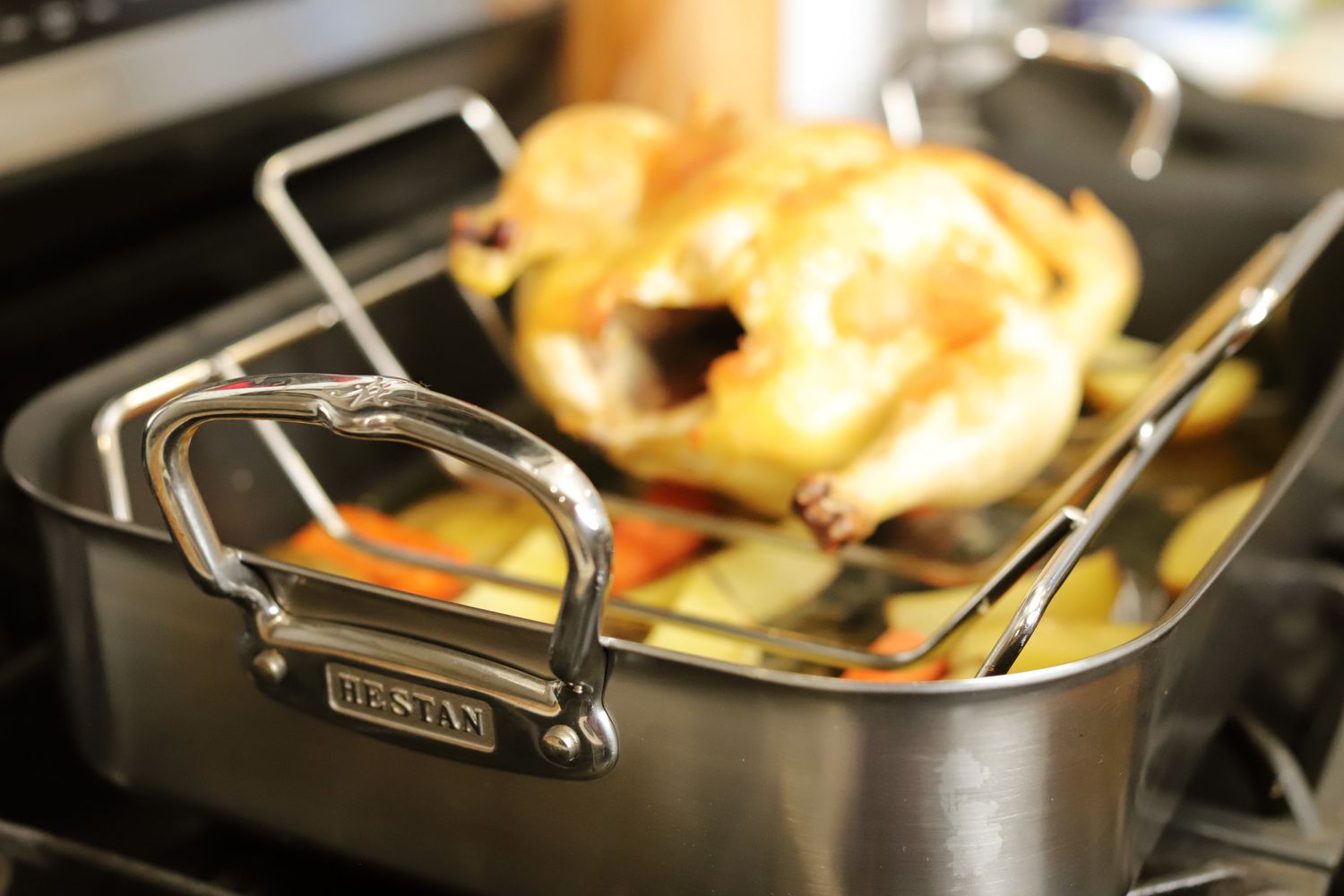 Close-up of the large handle on the Hestan Stainless Steel Nonstick Roaster