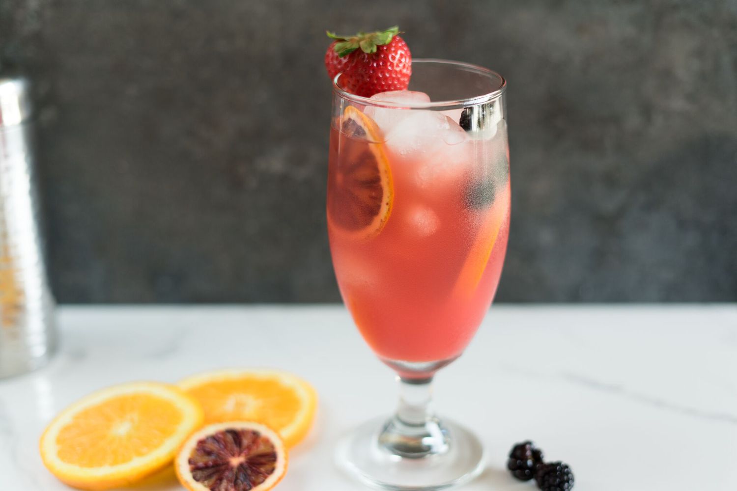 Rum runner cocktail in a glass with a strawberry garnish