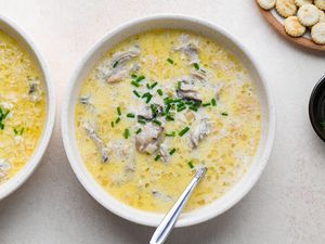 Simple Slow Cooker Oyster Stew in bowls, served with crackers 