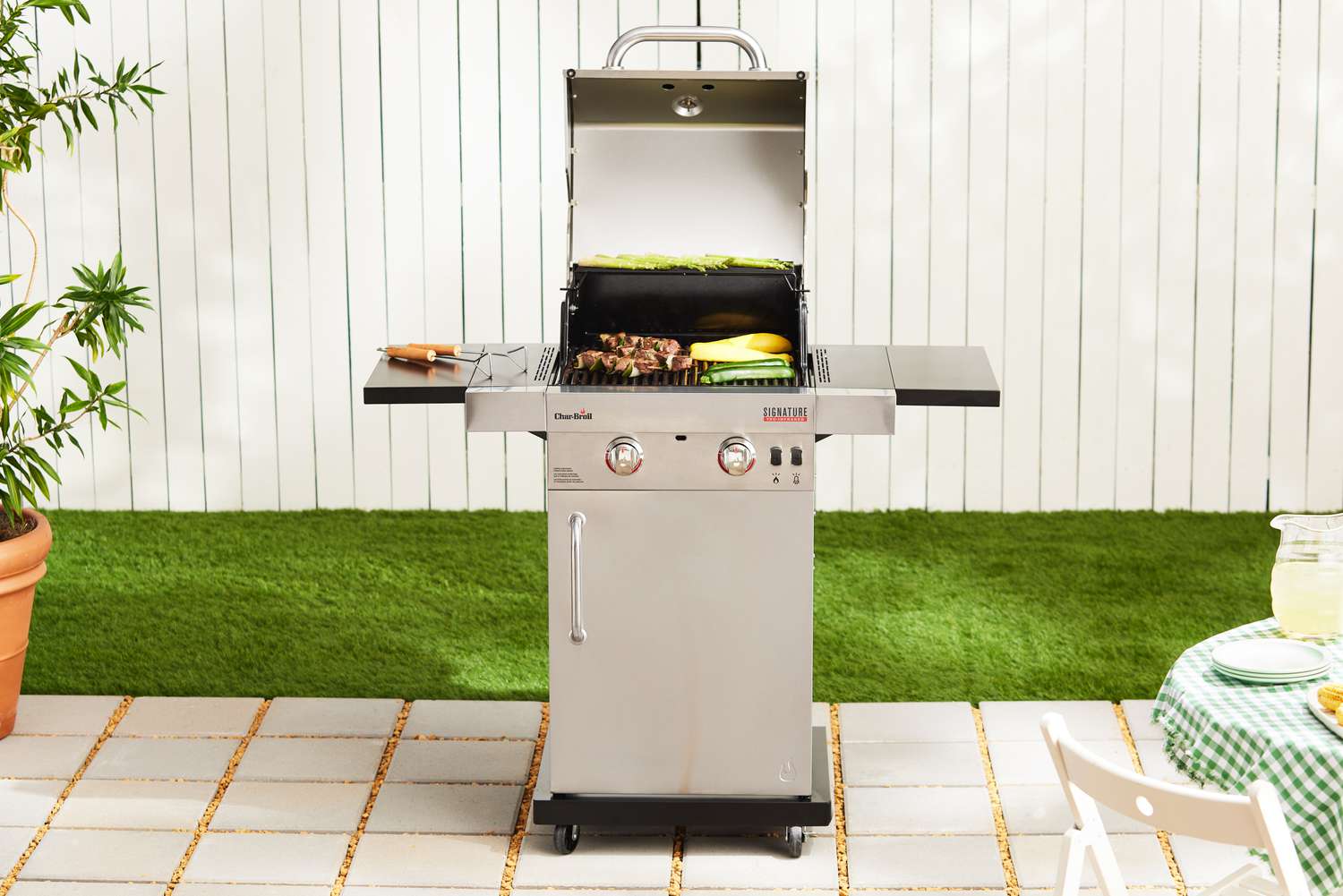 Char-Broil Signature Series Amplifire 2-Burner Gas Grill displayed on a patio