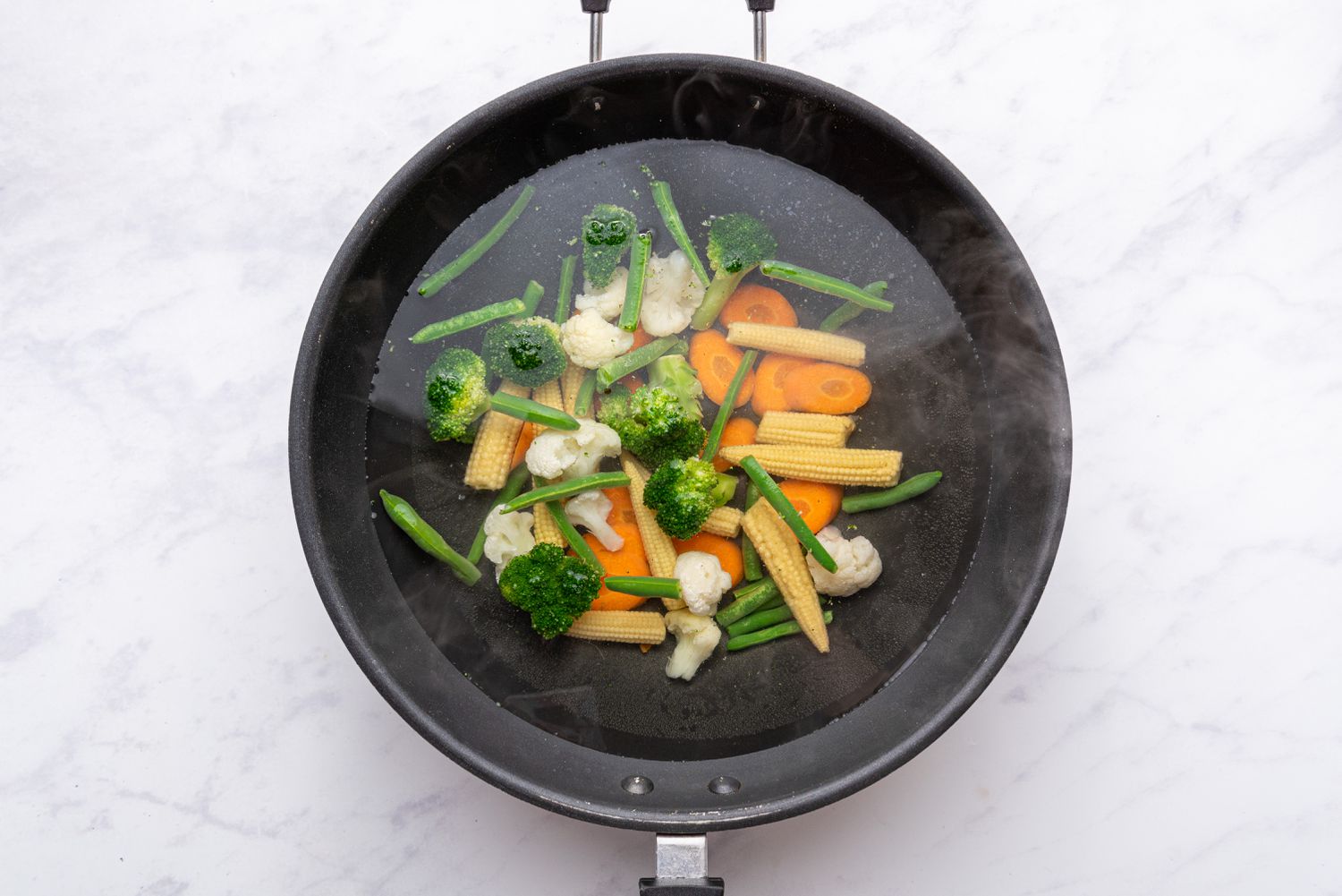 vegetables in a pan with water