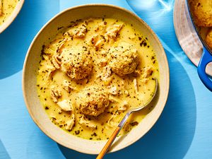 Keto Chicken and Dumplings in a bowl with a spoon 