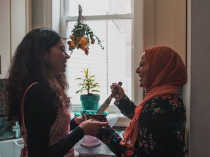 Two arab woman preparing for a birthday party