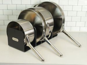 Caraway Stainless Steel Cookware set displayed in kitchen on rack