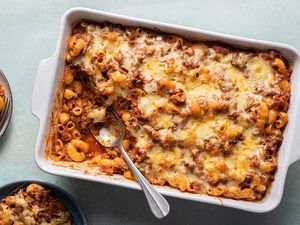 Macaroni and beef casserole in a baking dish with a spoon 