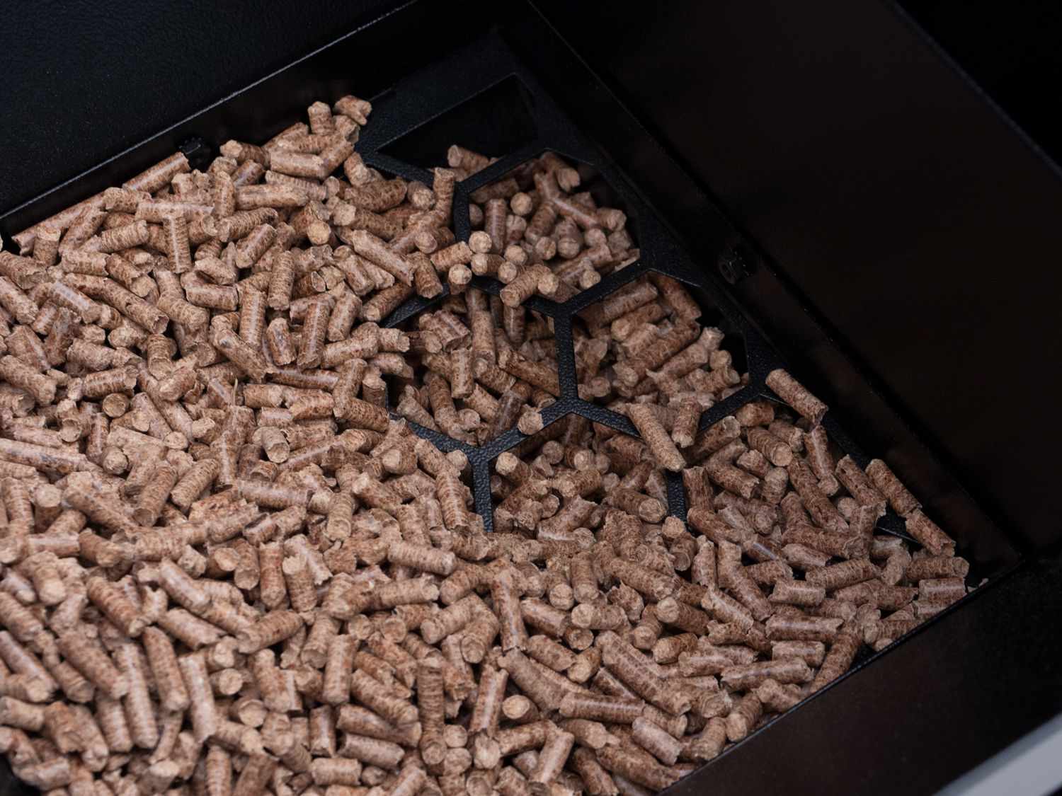 Wood pellets inside the Camp Chef SmokePro DLX Pellet Grill