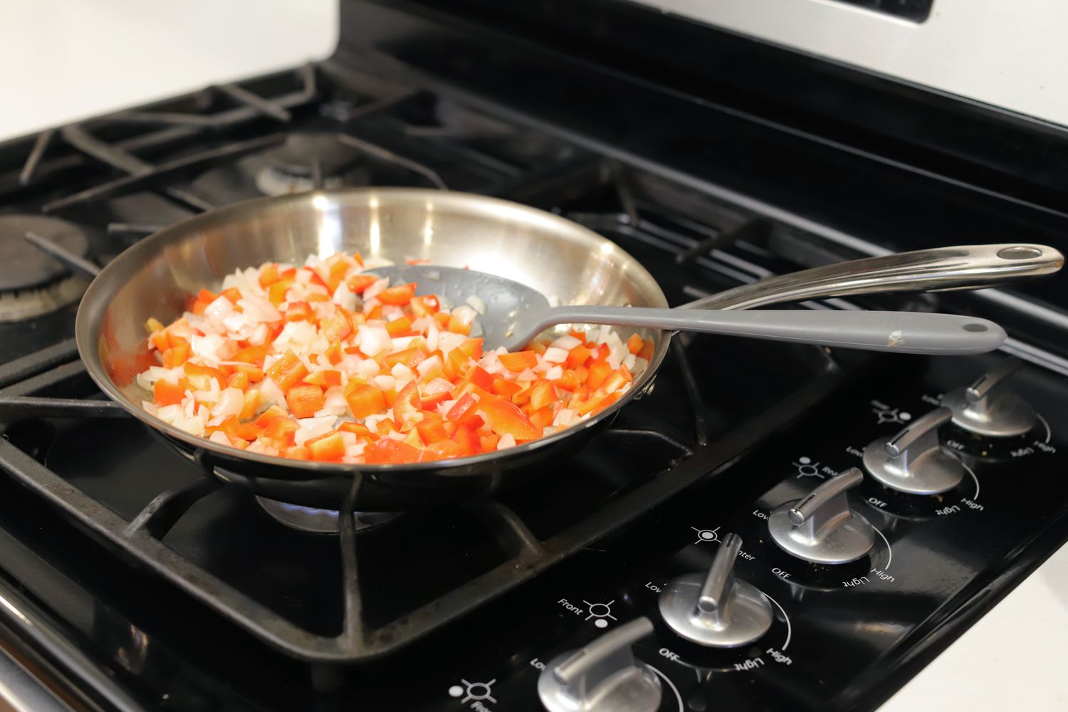 Sauteing vegetable in the All-Clad G5 frying pan on a gas stove