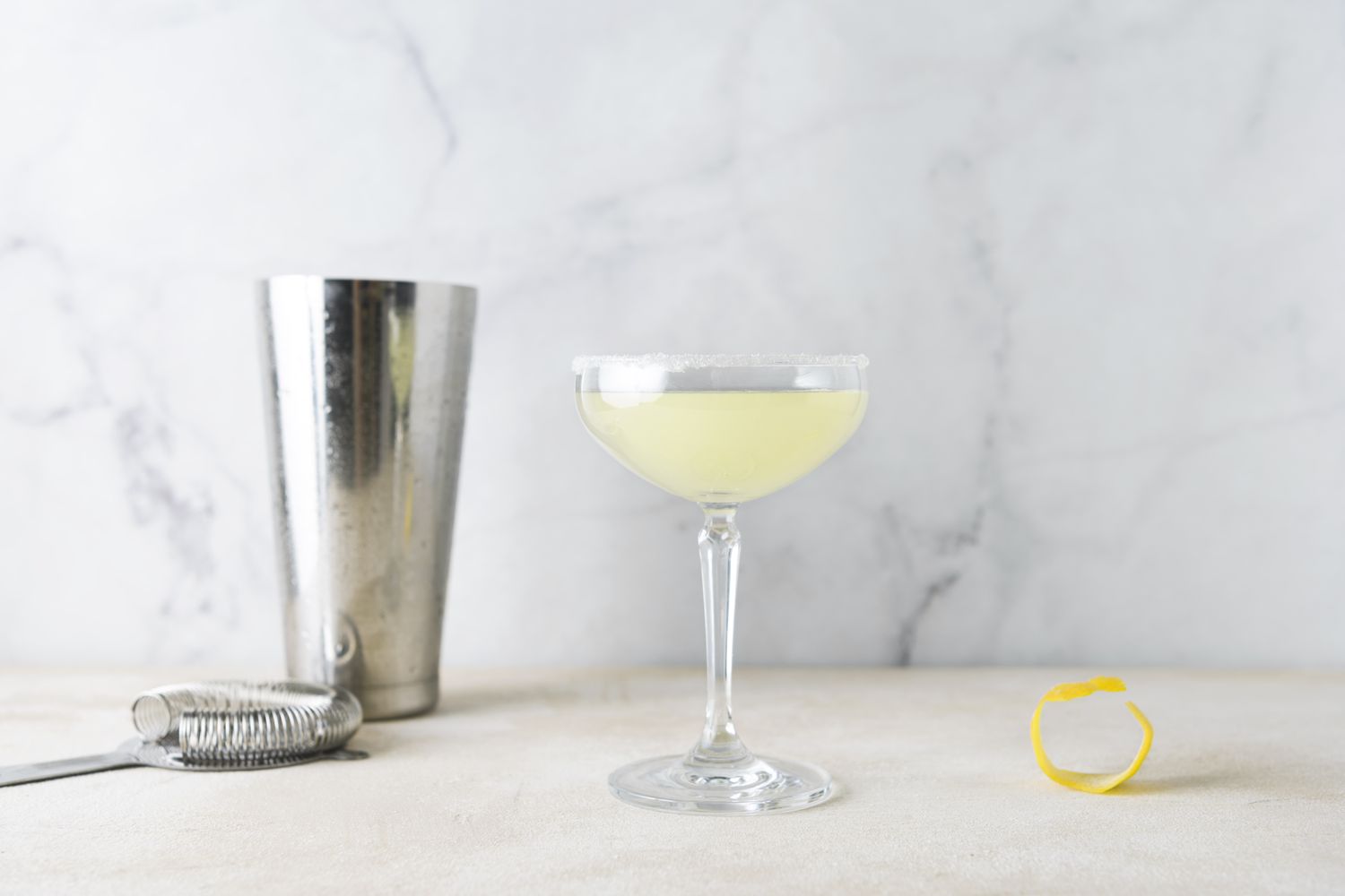 Lemon drop martini strained into sugar-rimmed glass 