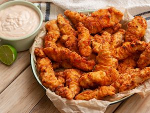 Spicy fried chicken strips in a bowl