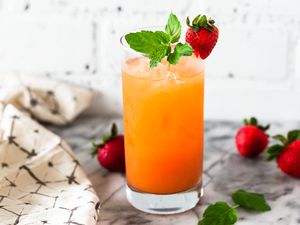 Zombie cocktail garnished with mint and strawberry