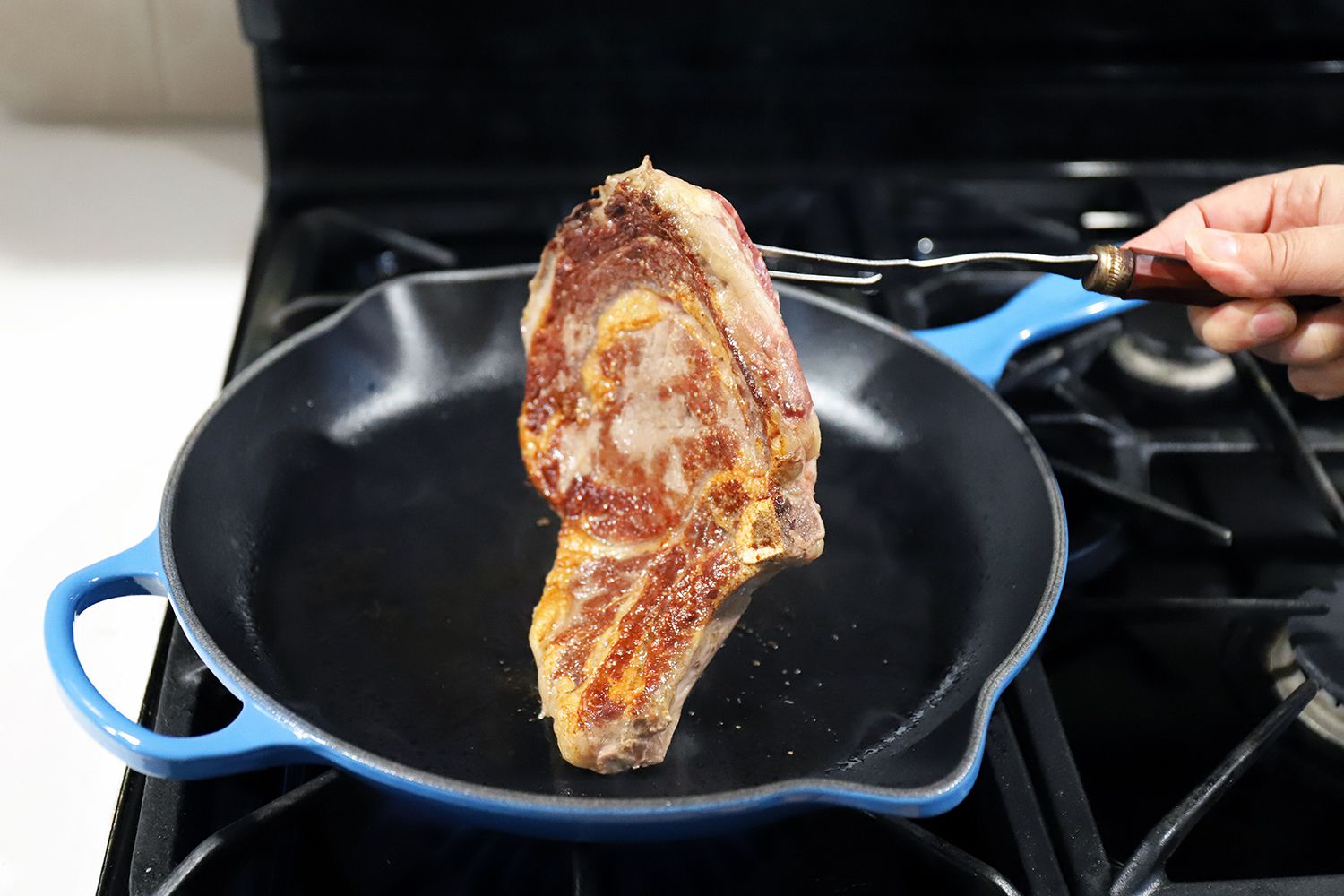 Le Creuset Signature Skillet after searing a pork chop