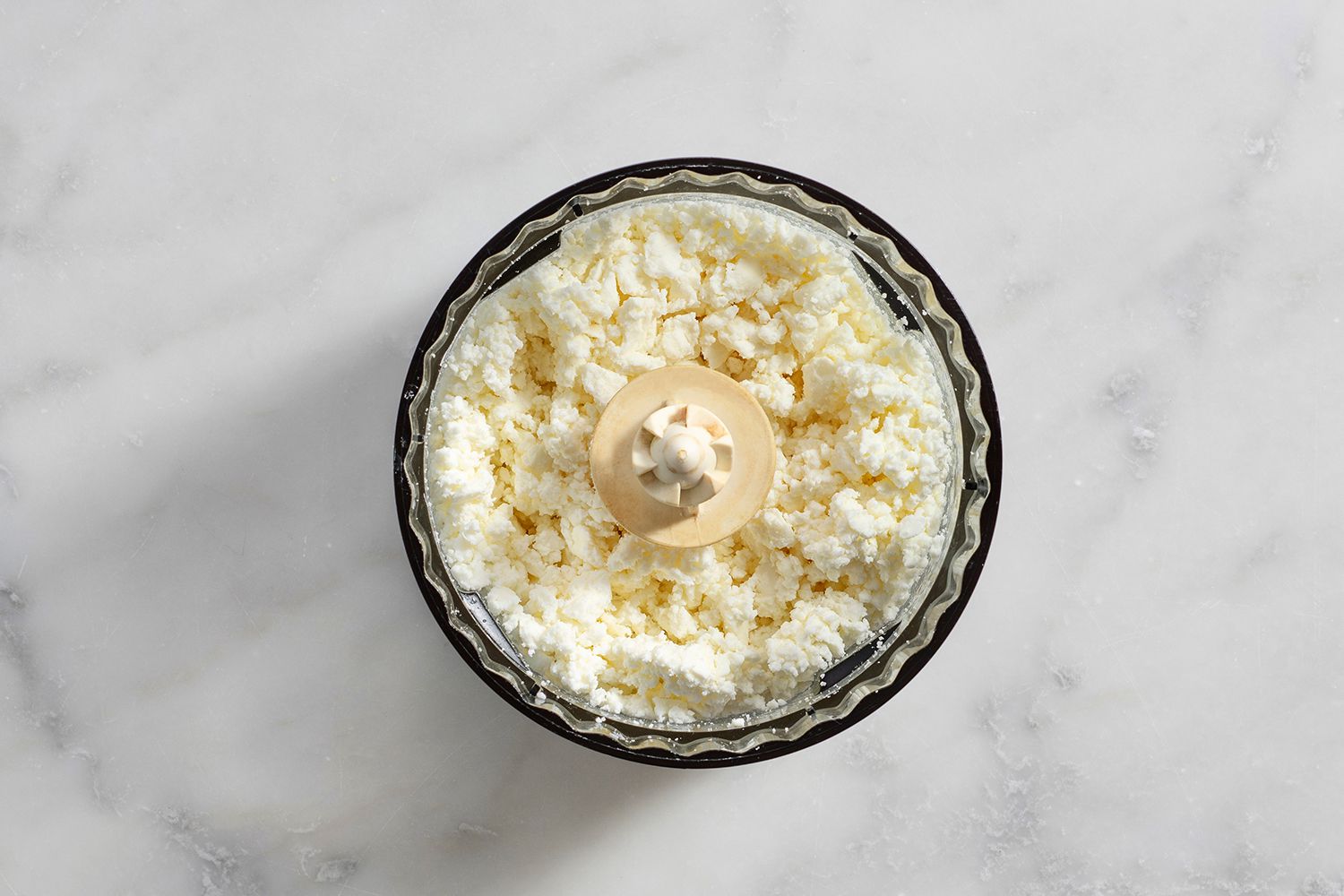 Crumbled feta in a food processor