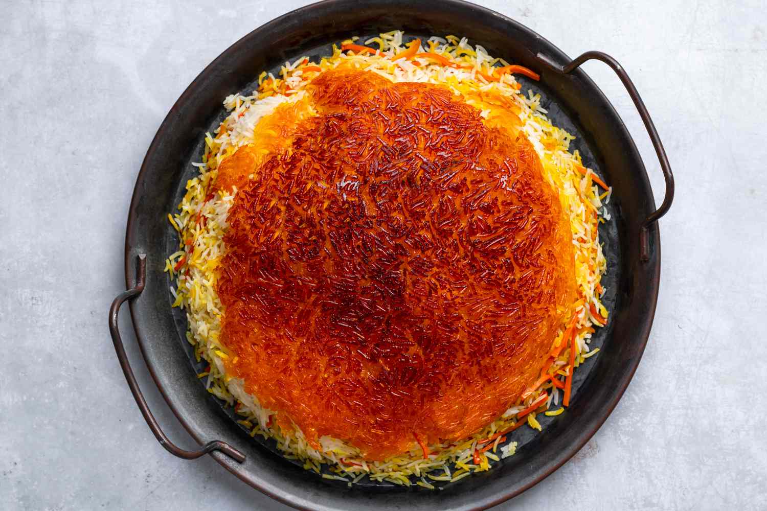 Cooked rice and carrot mixture inverted onto a large plate