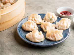 Chinese Shrimp Dumplings (Har Gow) on a blue plate