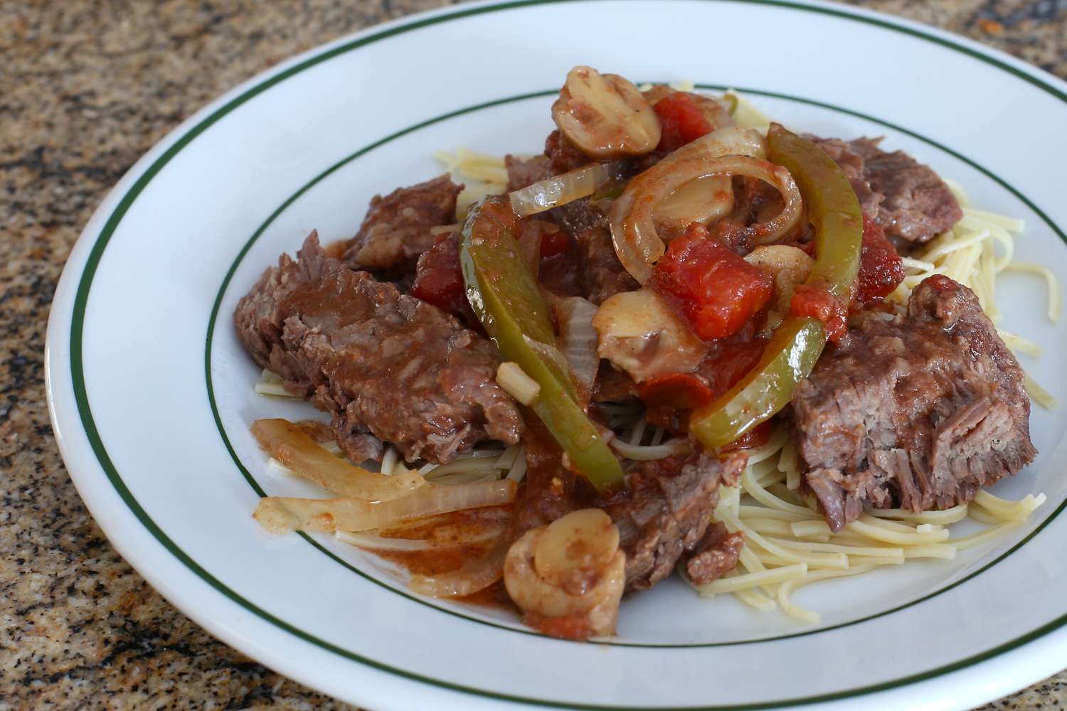 Smothered steak with peppers, slow cooker.