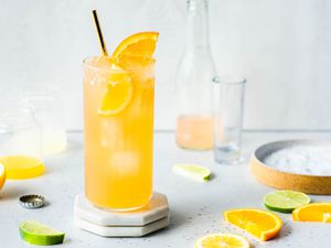 Cantarito Tequila Cocktail recipe, cocktail in a glass with orange and lime slices