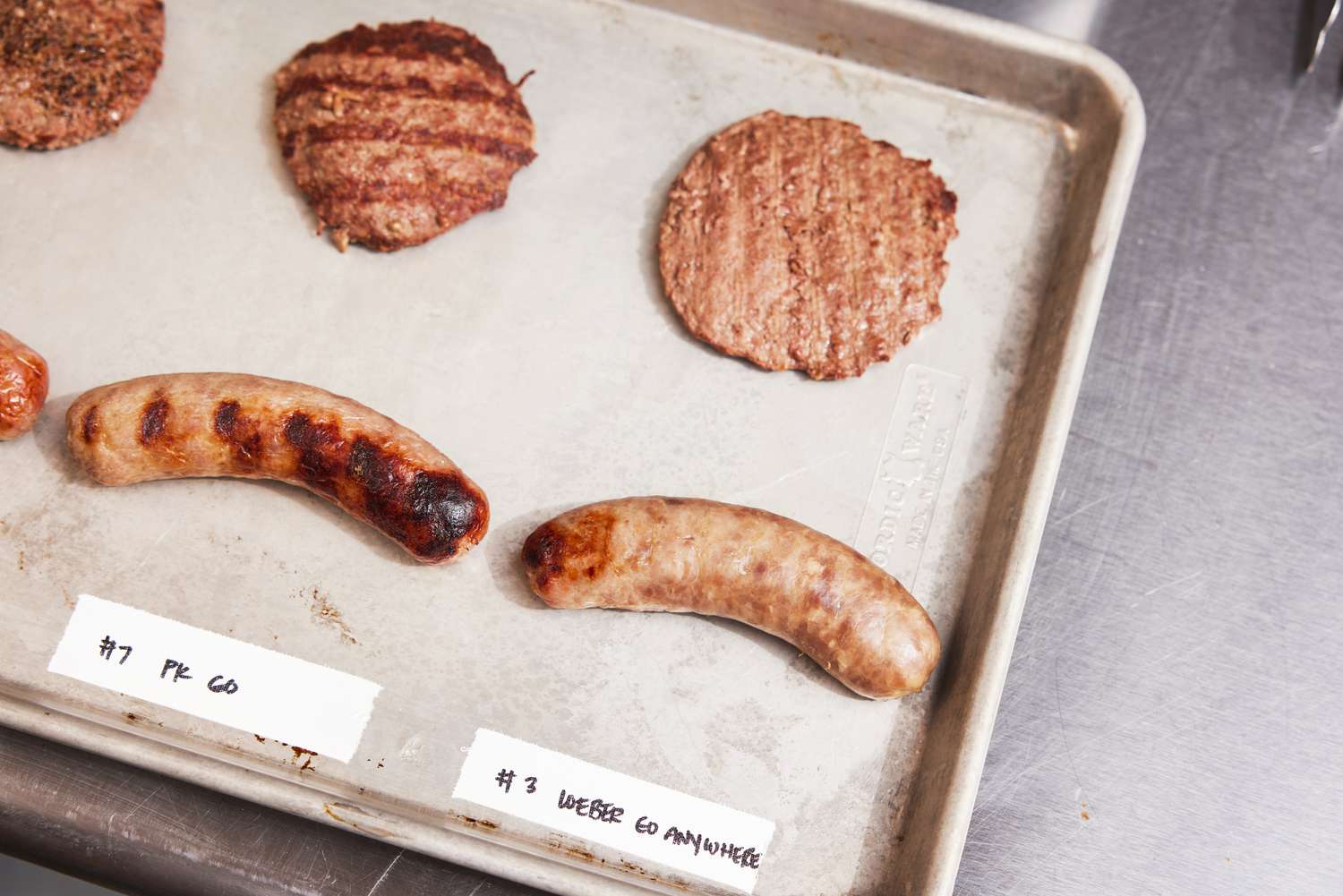 a burger and a sausage cooked from a Weber Go-Anywhere Charcoal Grill