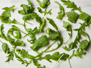 Arugula leaves on marble surface