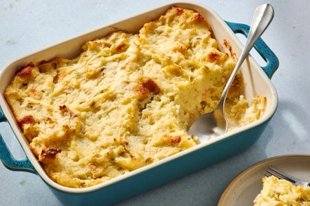 A baking dish of Pennsylvania Dutch potato filling, with a plated portion