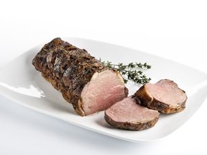 Cooked roast beef on a white plate