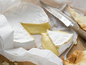 Brie wrapped in paper