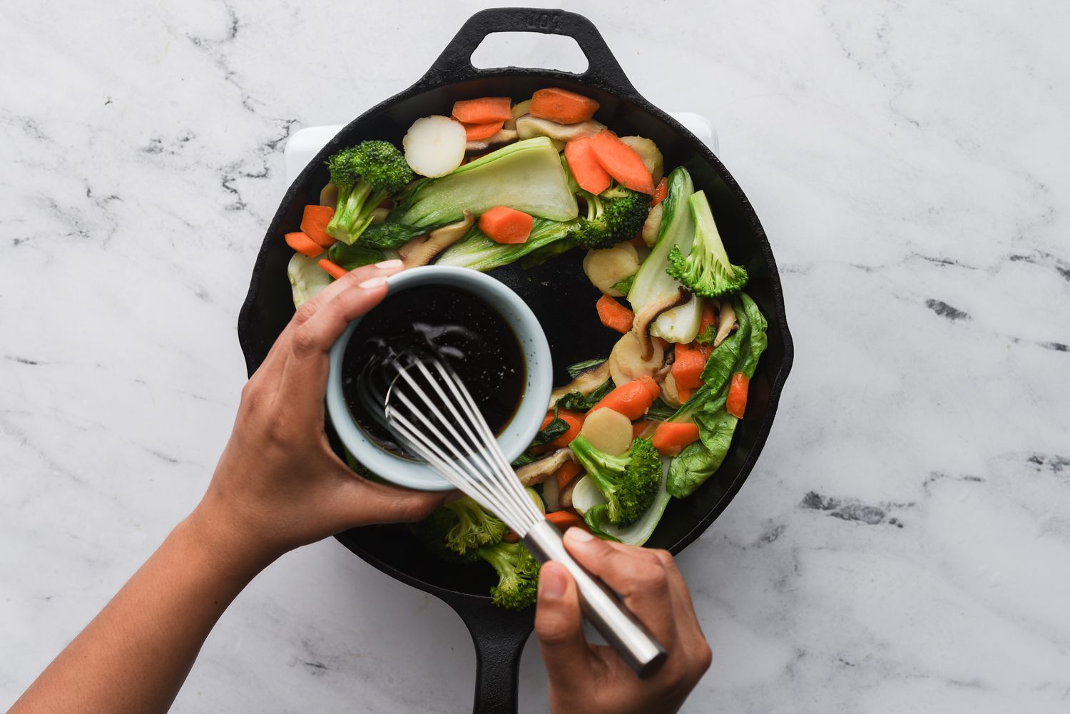 pour sauce into the skillet with the vegetables 