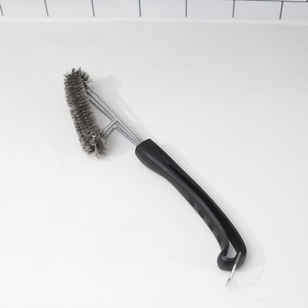 Kona 360° Clean Grill Brush displayed on marble countertop with nearby tile backsplash