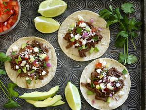 Barbacoa tacos with fixings.