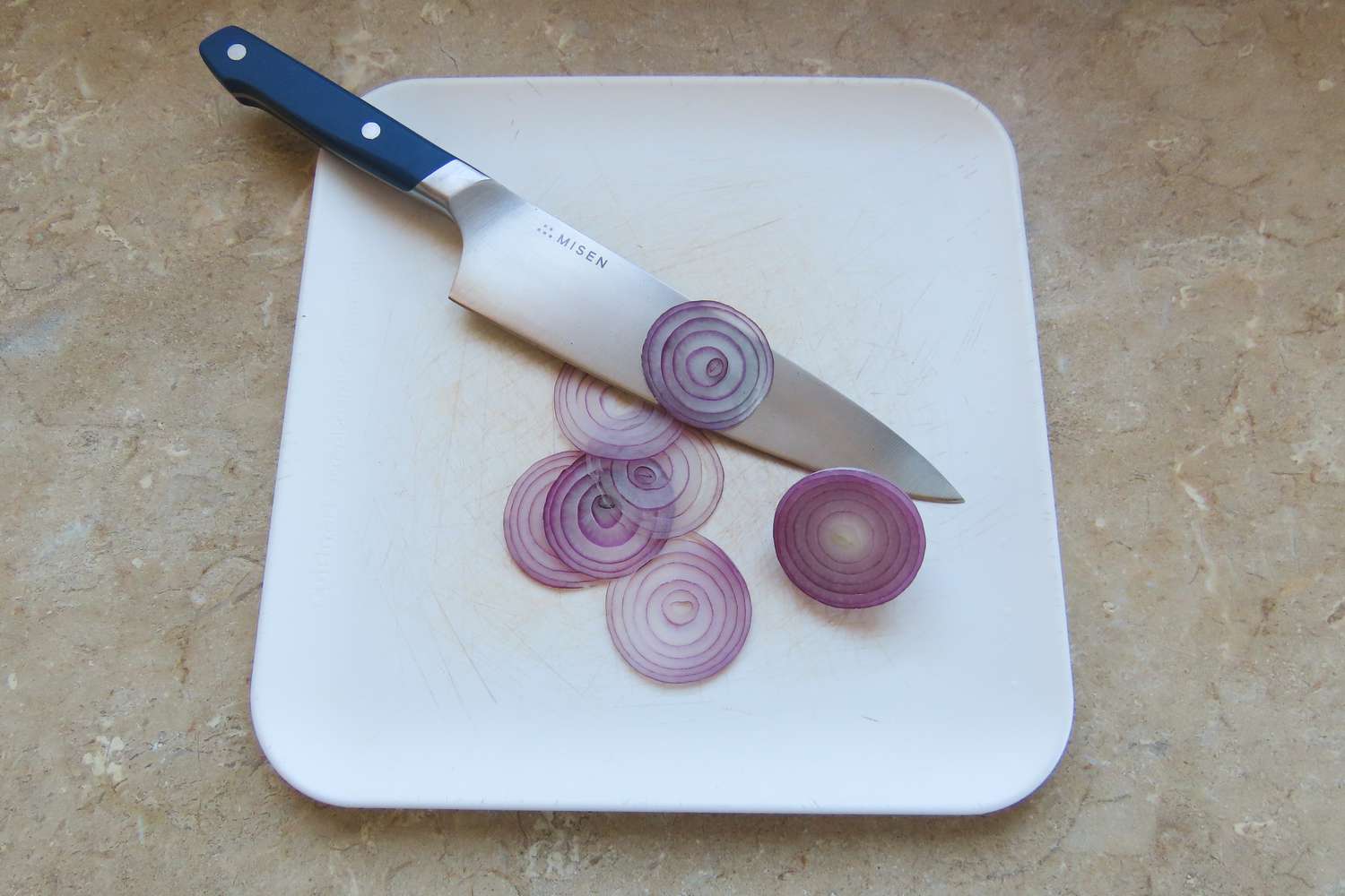 misen chef's knife after finely slicing red onion