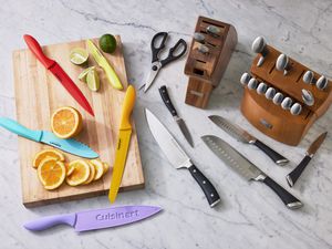 Assortment of the best knife sets we recommend displayed on a marbled surface