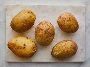 microwave potatoes to start cooking process