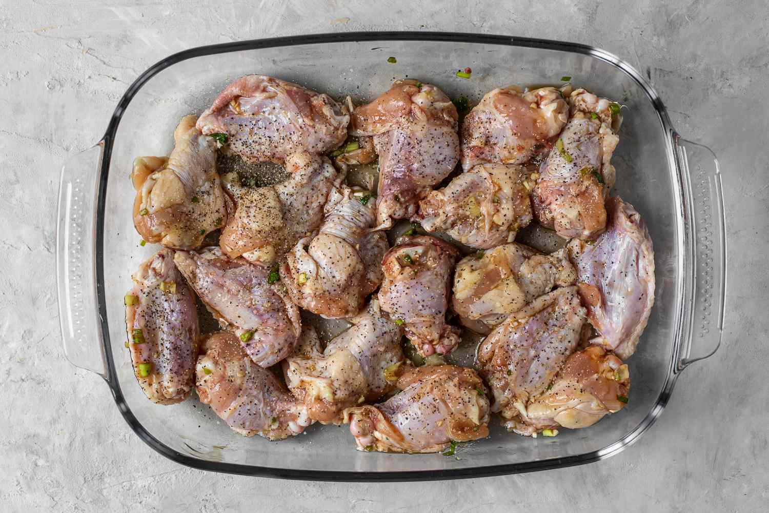 Place the chicken in a shallow glass baking dish and brush with part of the glazing sauce