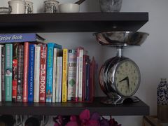 Stack of cookbooks on a shelf