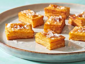 A plate of million layer potatoes stopped with flaky salt