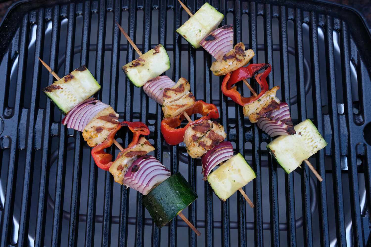 Shish kebabs grilling on the Weber Q1400 Electric Grill