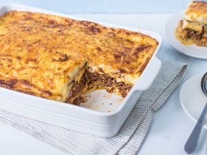 Greek Eggplant Moussaka in a white casserole dish