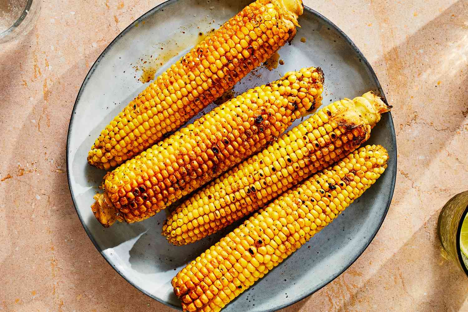 A platter of cajun-style corn on the cob