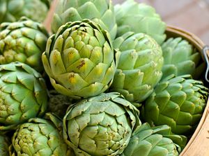 Fresh artichokes in a basket