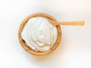 sour cream in a wooden bowl