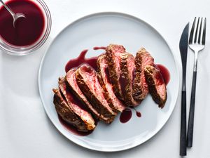 Classic French Bordelaise sauce over steak on a white plate