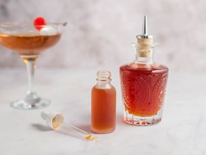Basic homemade cocktail bitters recipe in glasses and jars