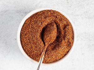 Barbecue beef rib rub in a bowl with a spoon