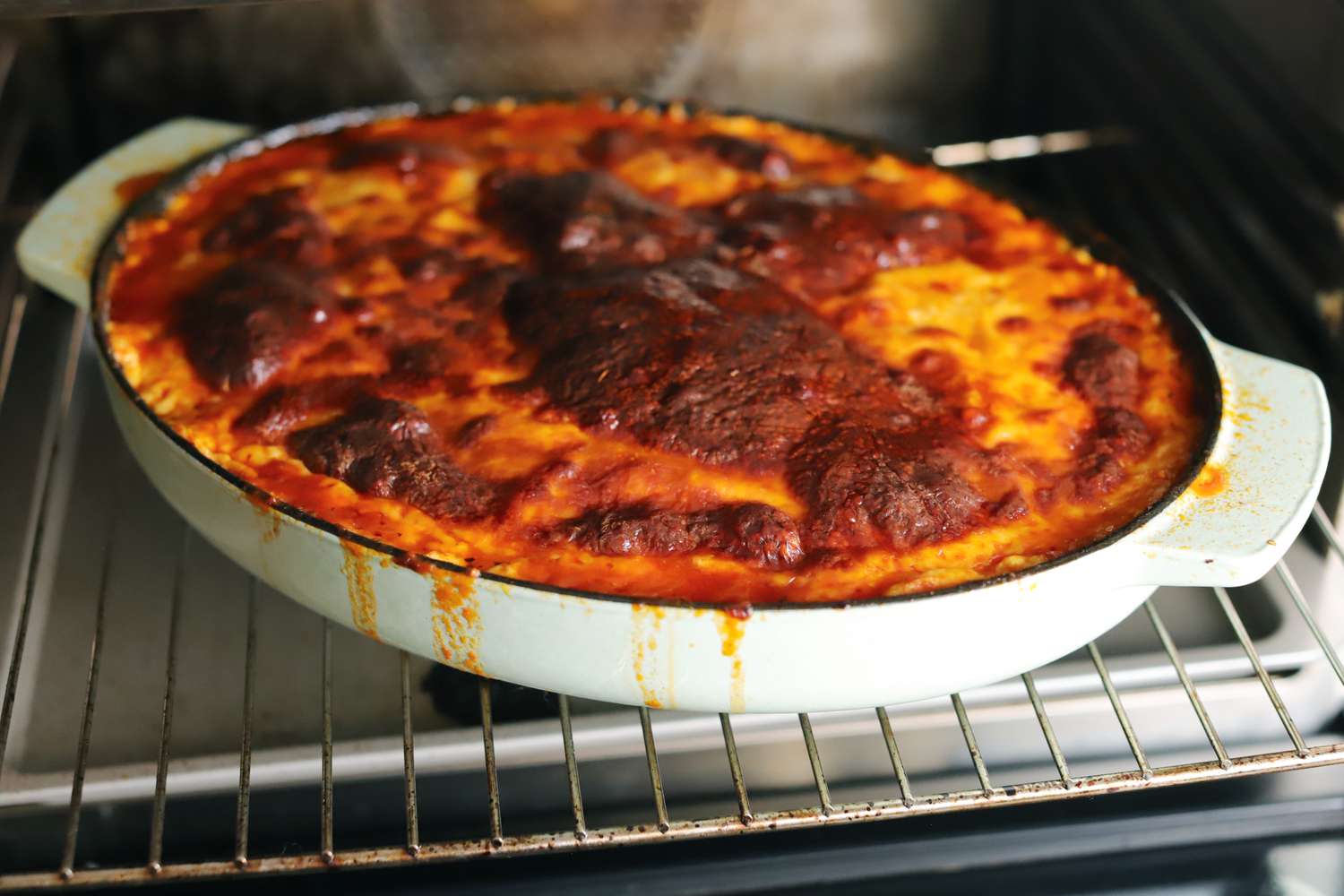 A gratin baking in the KitchenAid oval cast iron roasting pan