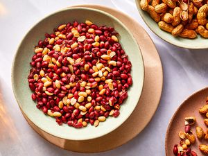 Oven-roasted peanuts in a bowl with shell-on peanuts 