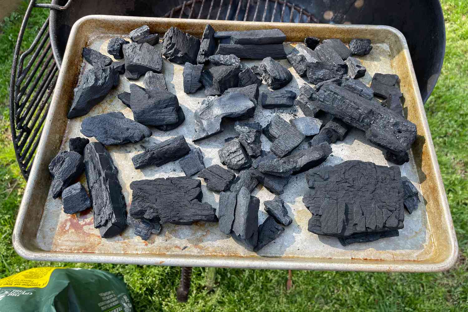 Big Green Egg Natural Oak and Hickory Lump Charcoal on a baking sheet