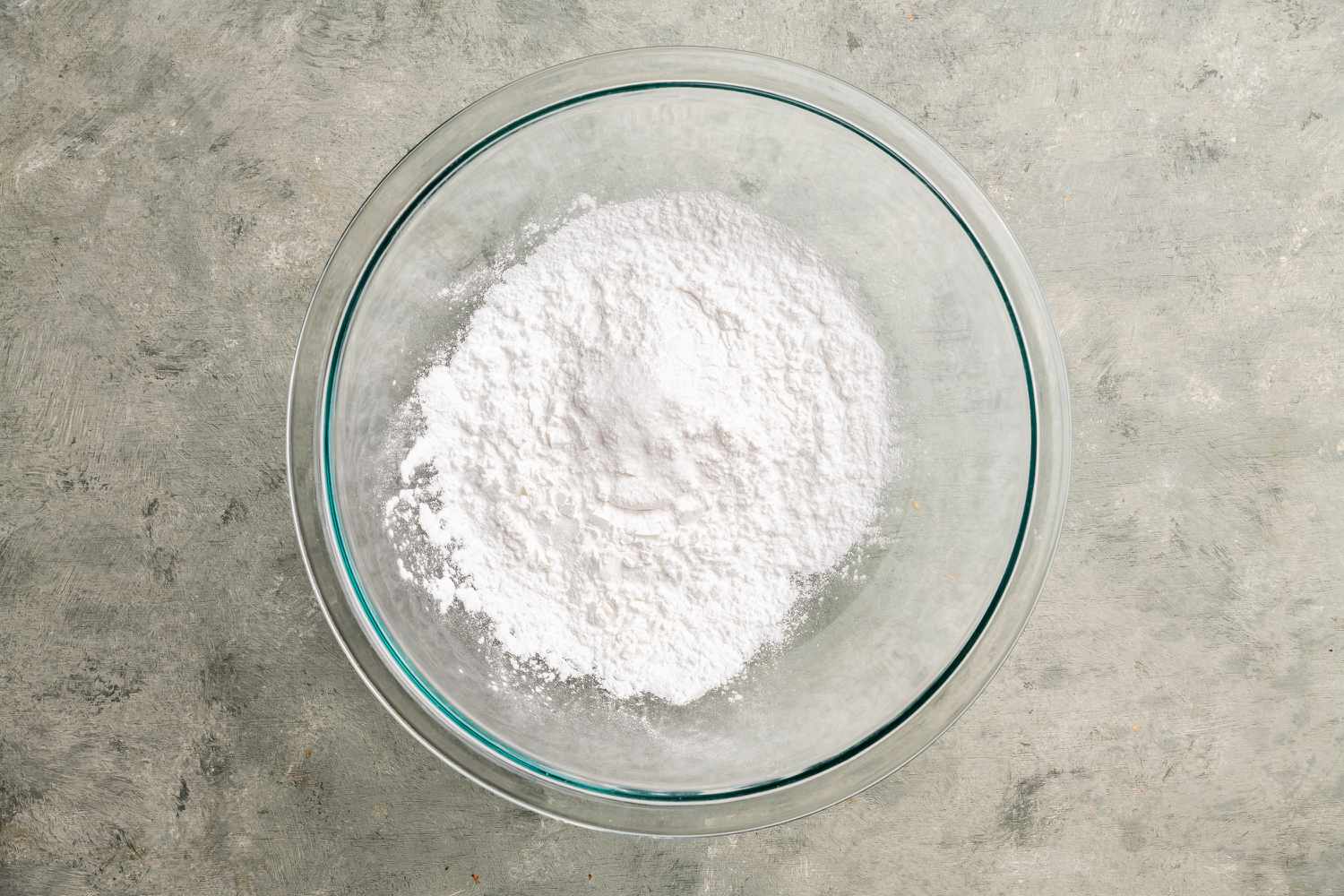 Starches and salt combined in a glass bowl for har gow dough