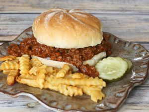 sloppy joe with barbecue sauce and some sausage