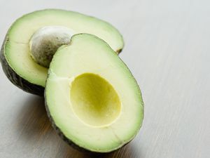 Halved avocado on tabletop