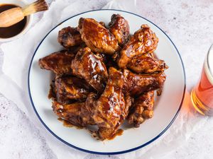 Broiled BBQ Chicken Wings on a white plate