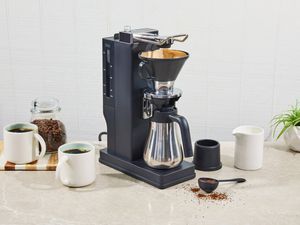 The BALMUDA The Brew Coffee Maker on a kitchen counter.